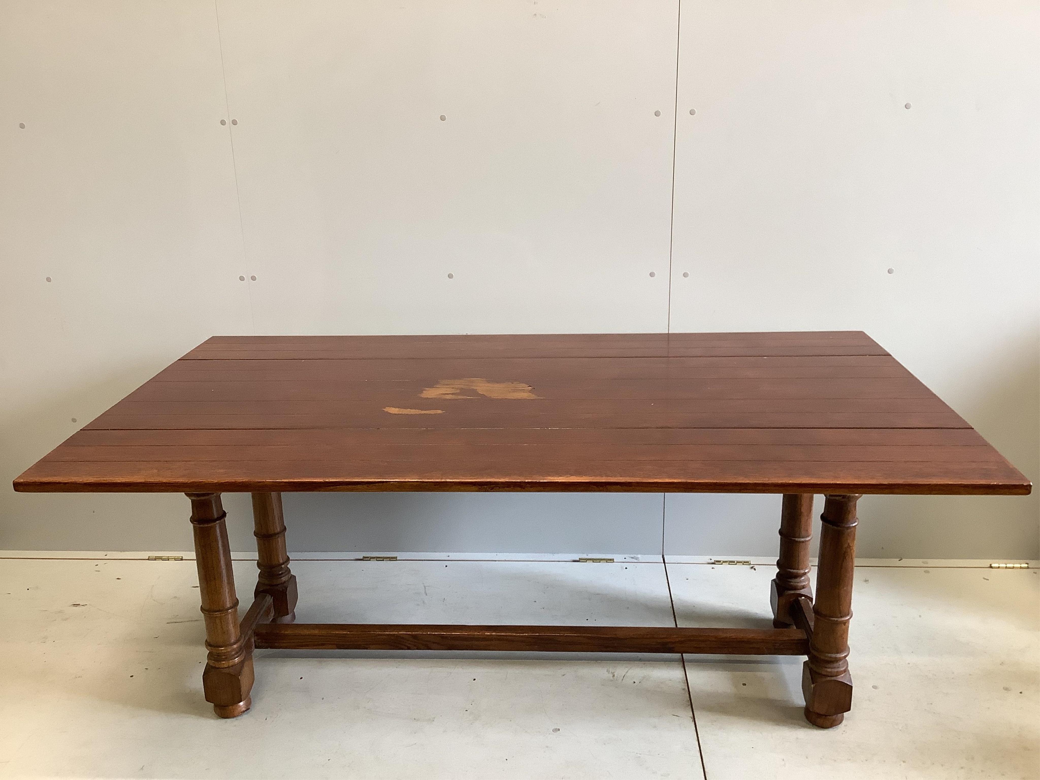 A 17th century style oak drop leaf refectory dining table, opens to 183 x 101cm, height 74cm, with a set of six Cromwellian style oak dining chairs. Condition - table with some marking to the top, upholstery to chairs wo